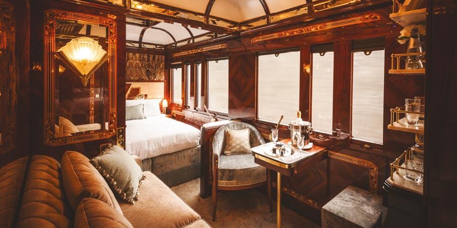 A decadent suite onboard the train: this suite includes a sofa, ornate decorations and even a personal bar for the customer. 