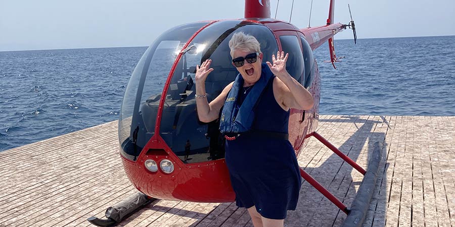 Angie excited to ride in a helicopter to see the Great Barrier Reef from above.